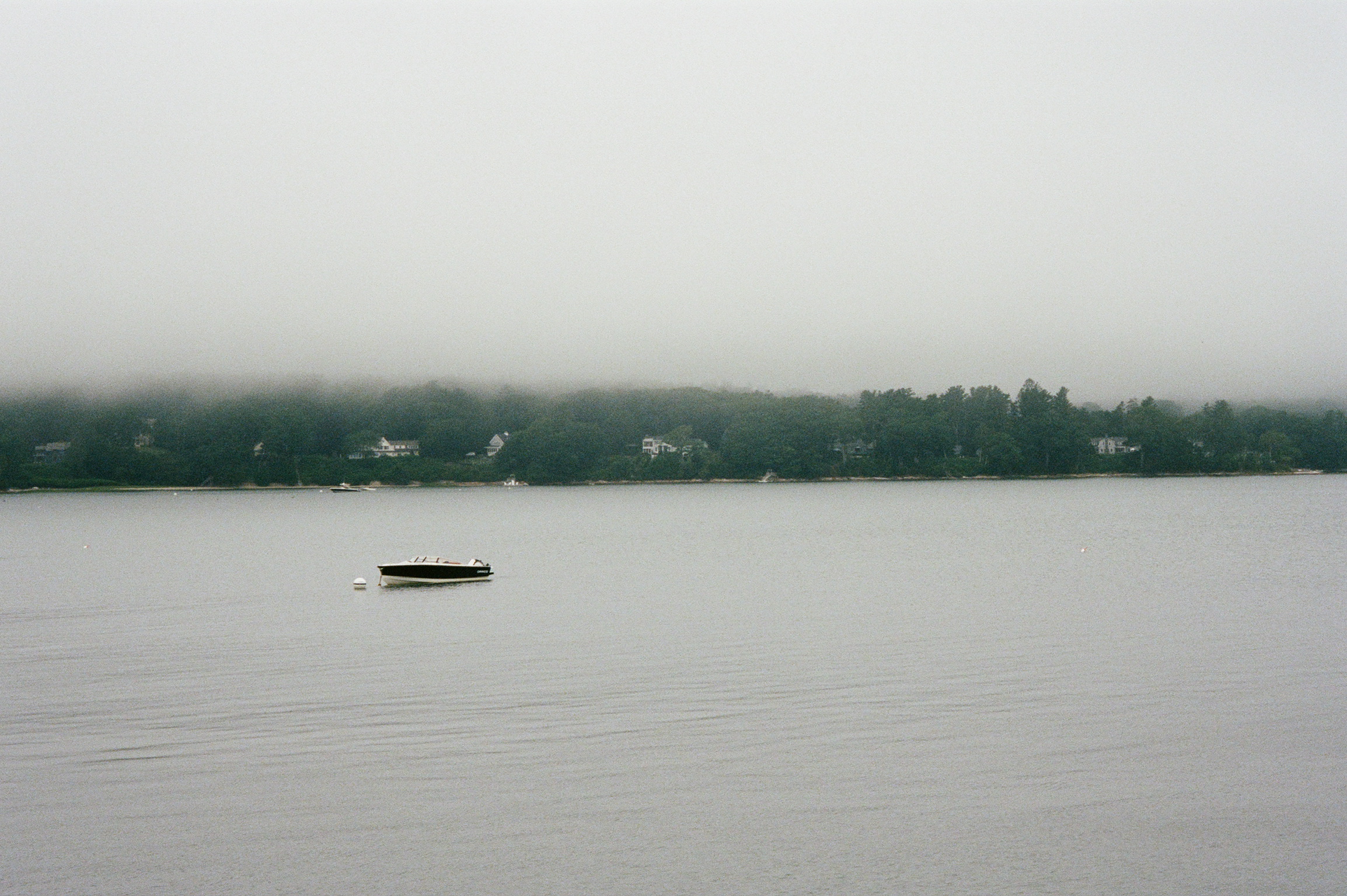 Misty morning on Casco Bay with a lone boat